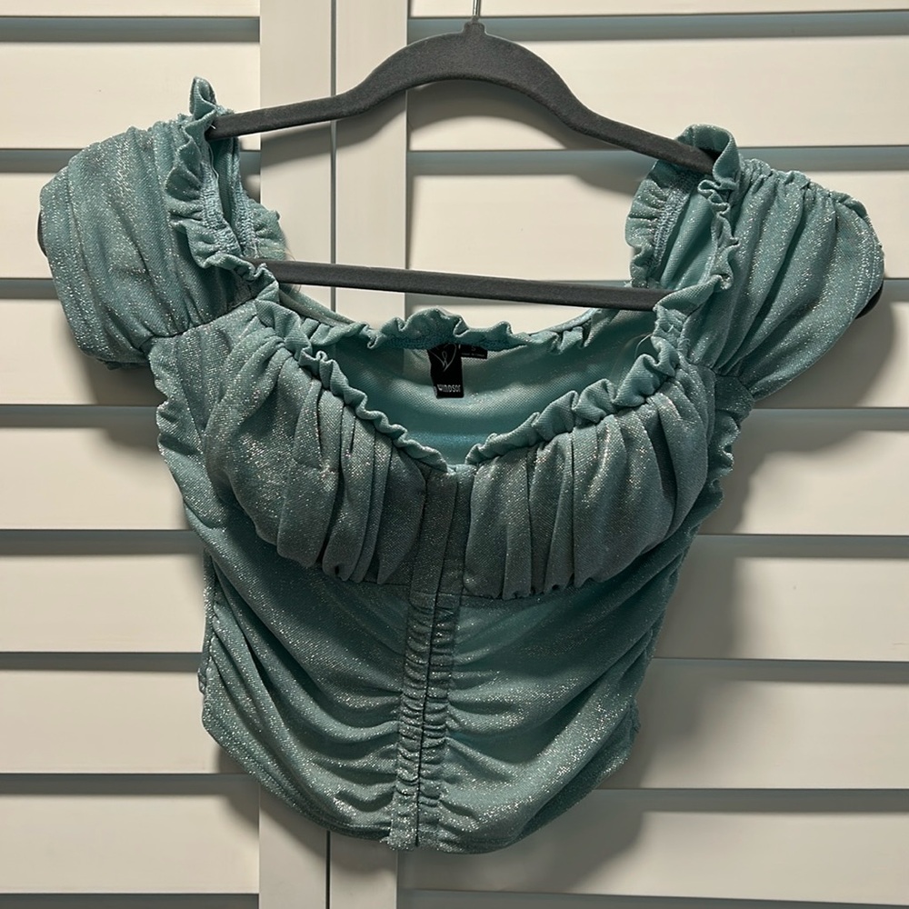 Glitter mesh bustier fabric
Off the shoulder neckline, ruffle trim